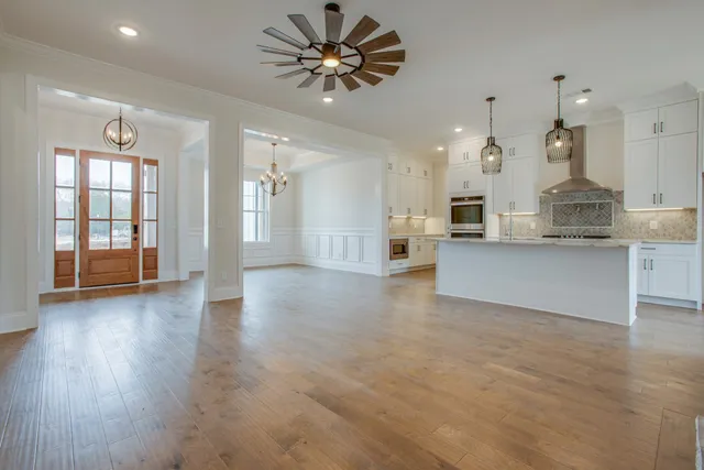 a view of kitchen with cabinets and wooden floor