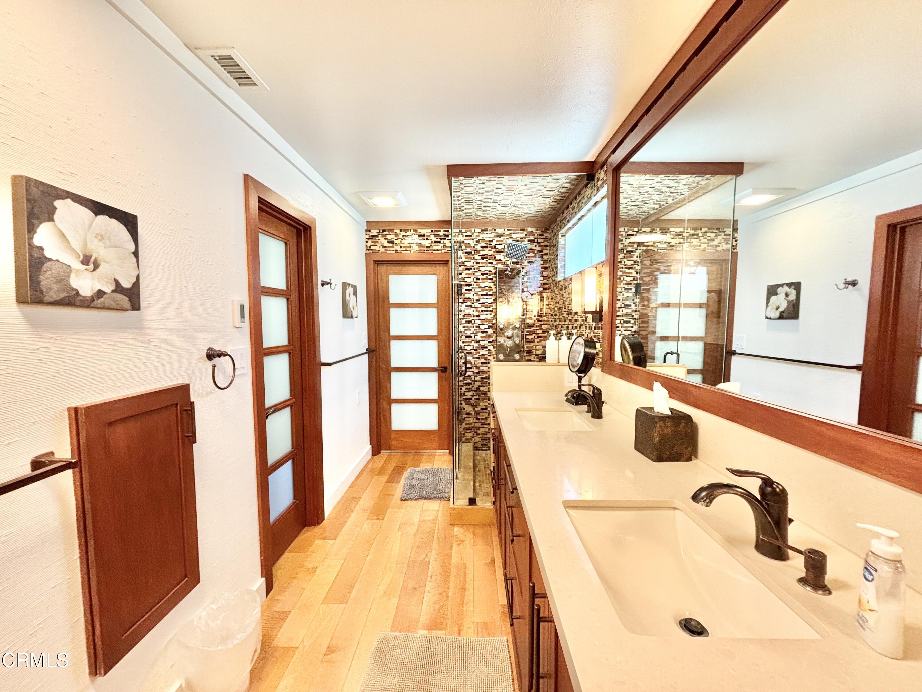 2524 Ocean Drive Oxnard, CA 93035 - Photo 11 of 28 a spacious bathroom with a tub sink and mirror