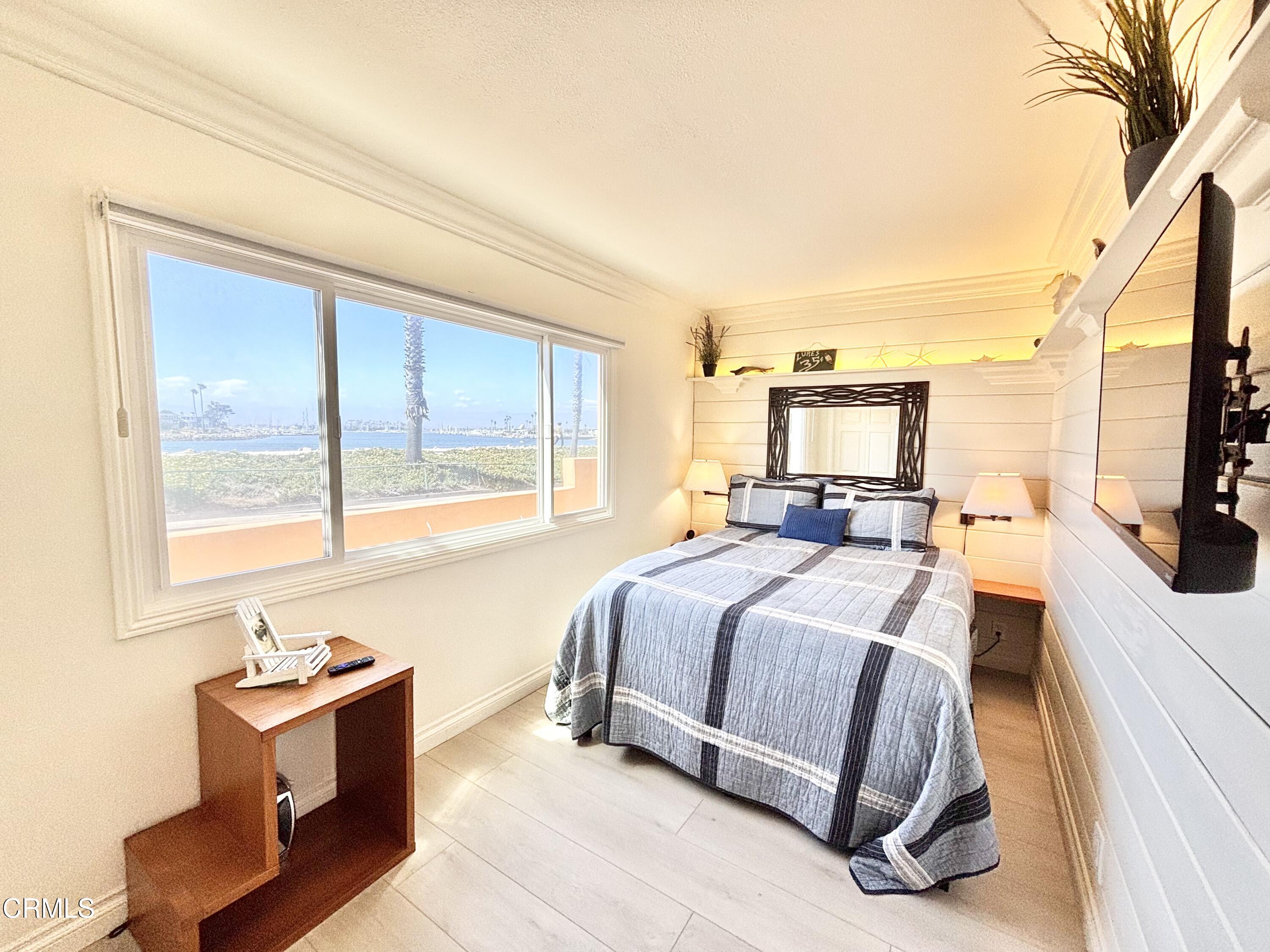2524 Ocean Drive Oxnard, CA 93035 - Photo 12 of 28 a spacious bedroom with a bed and large windows