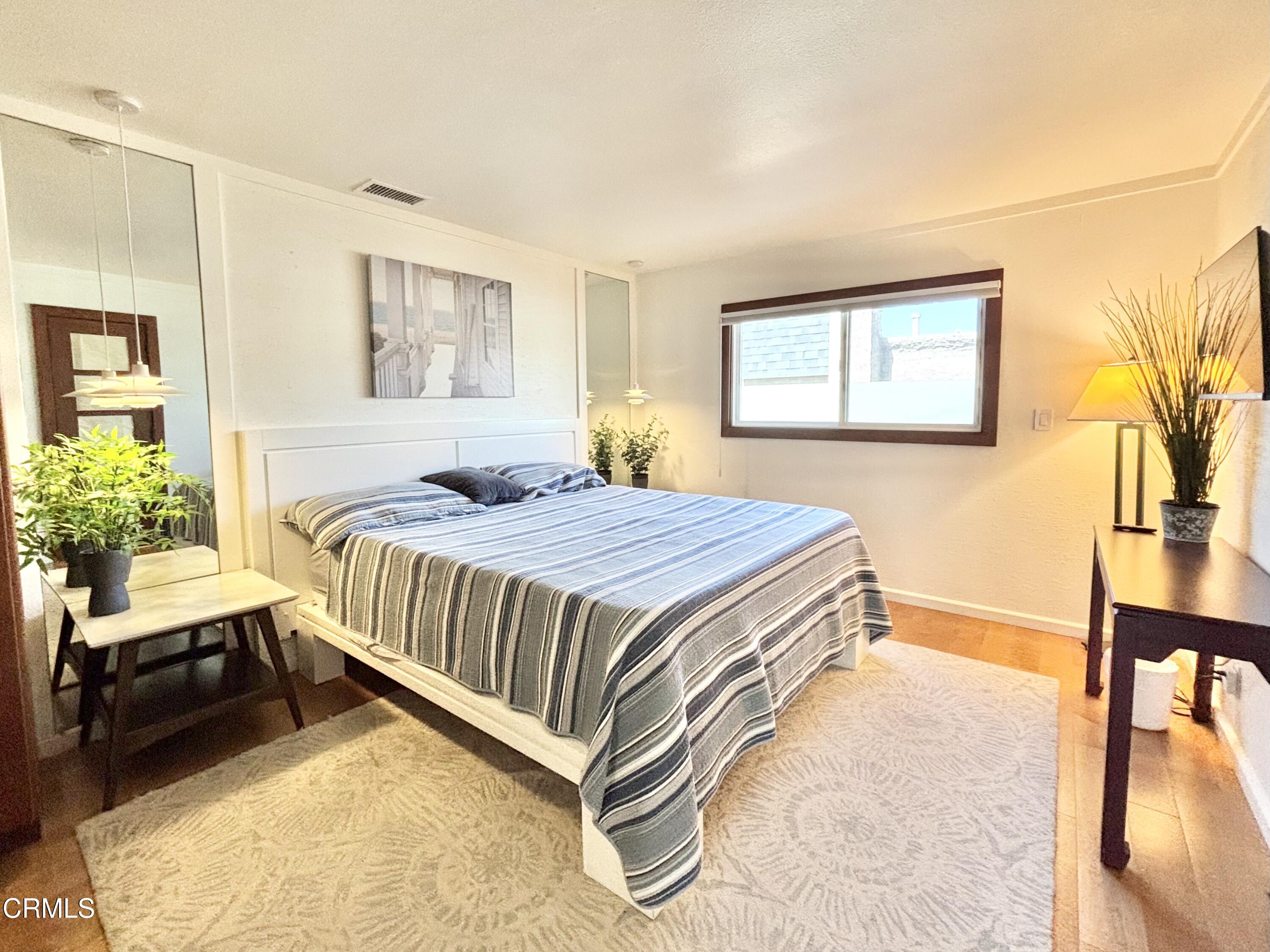 2524 Ocean Drive Oxnard, CA 93035 - Photo 13 of 28 a bedroom with a bed and a table in it