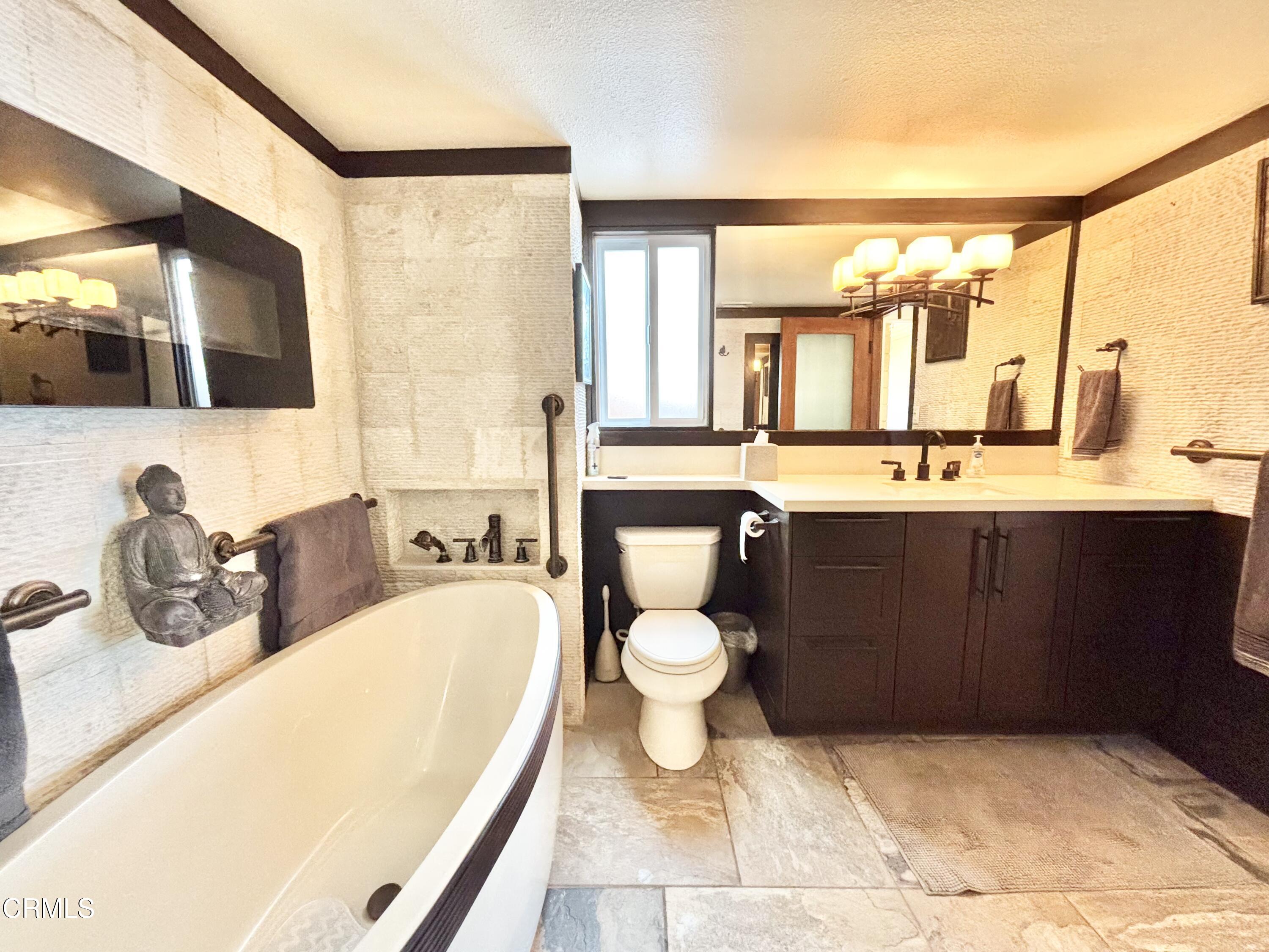 2524 Ocean Drive Oxnard, CA 93035 - Photo 15 of 28 a bathroom with a granite countertop sink and a mirror