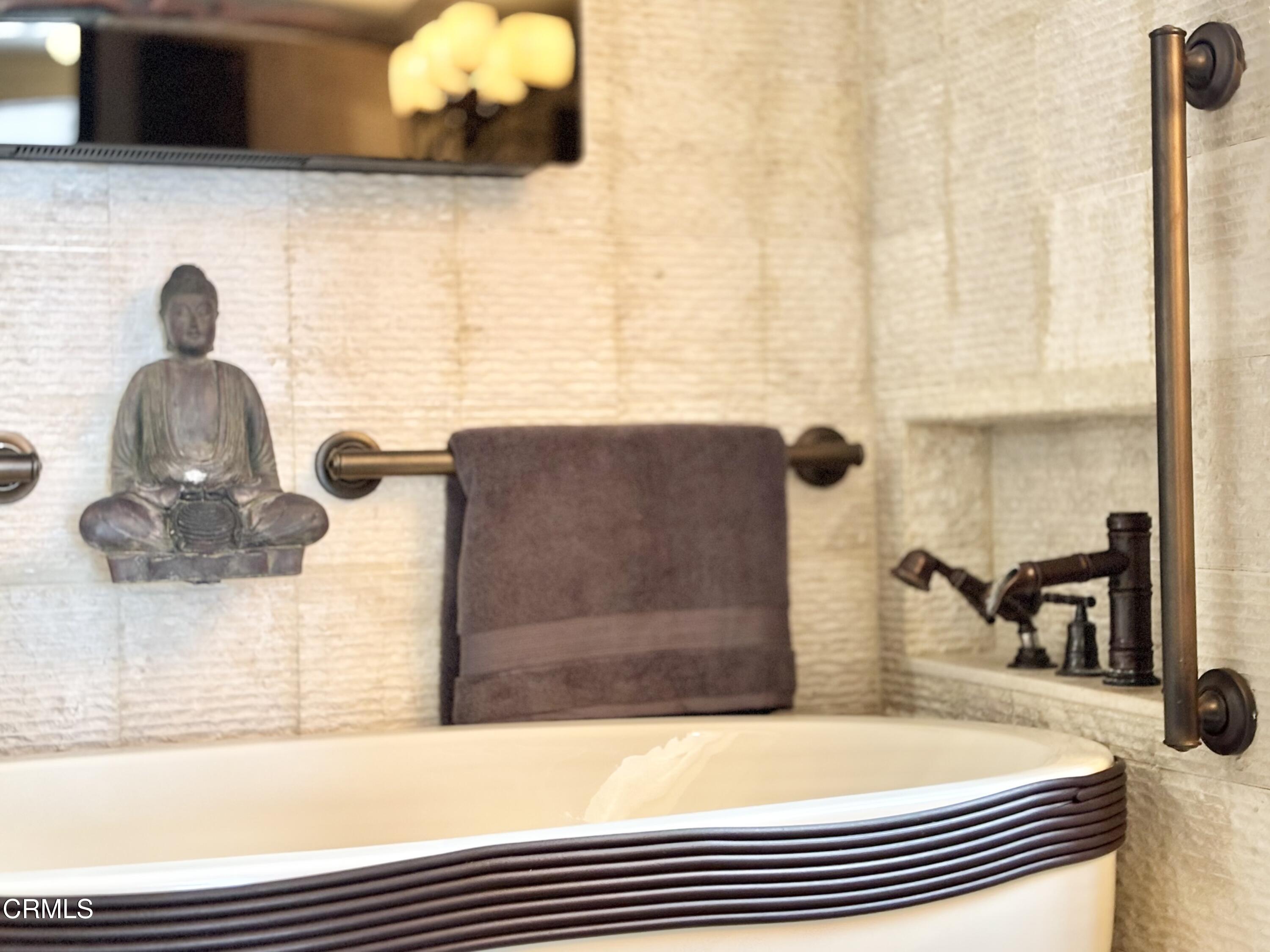 2524 Ocean Drive Oxnard, CA 93035 - Photo 16 of 28 a bathroom with a sink and a mirror