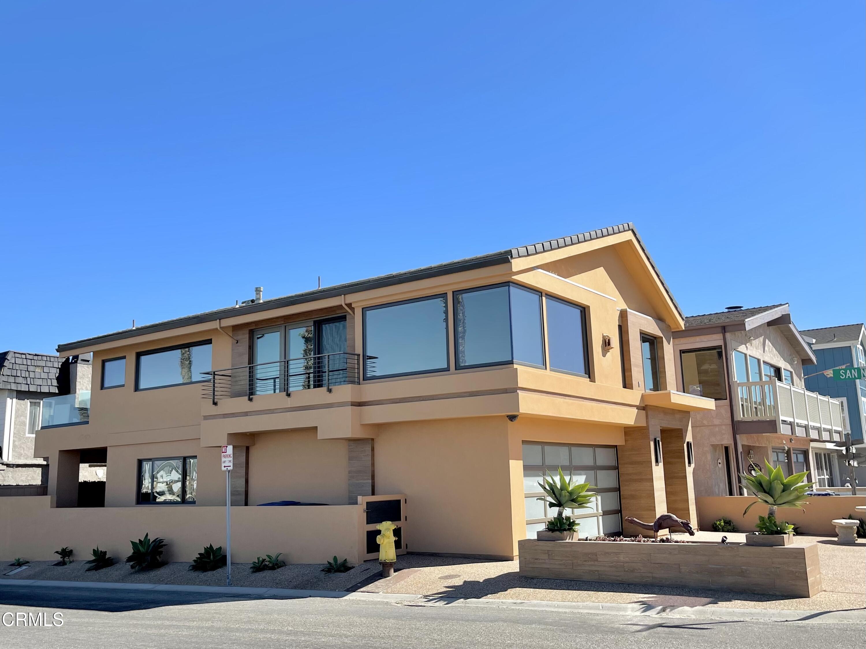2524 Ocean Drive Oxnard, CA 93035 - Photo 22 of 28 a front view of a house with a yard