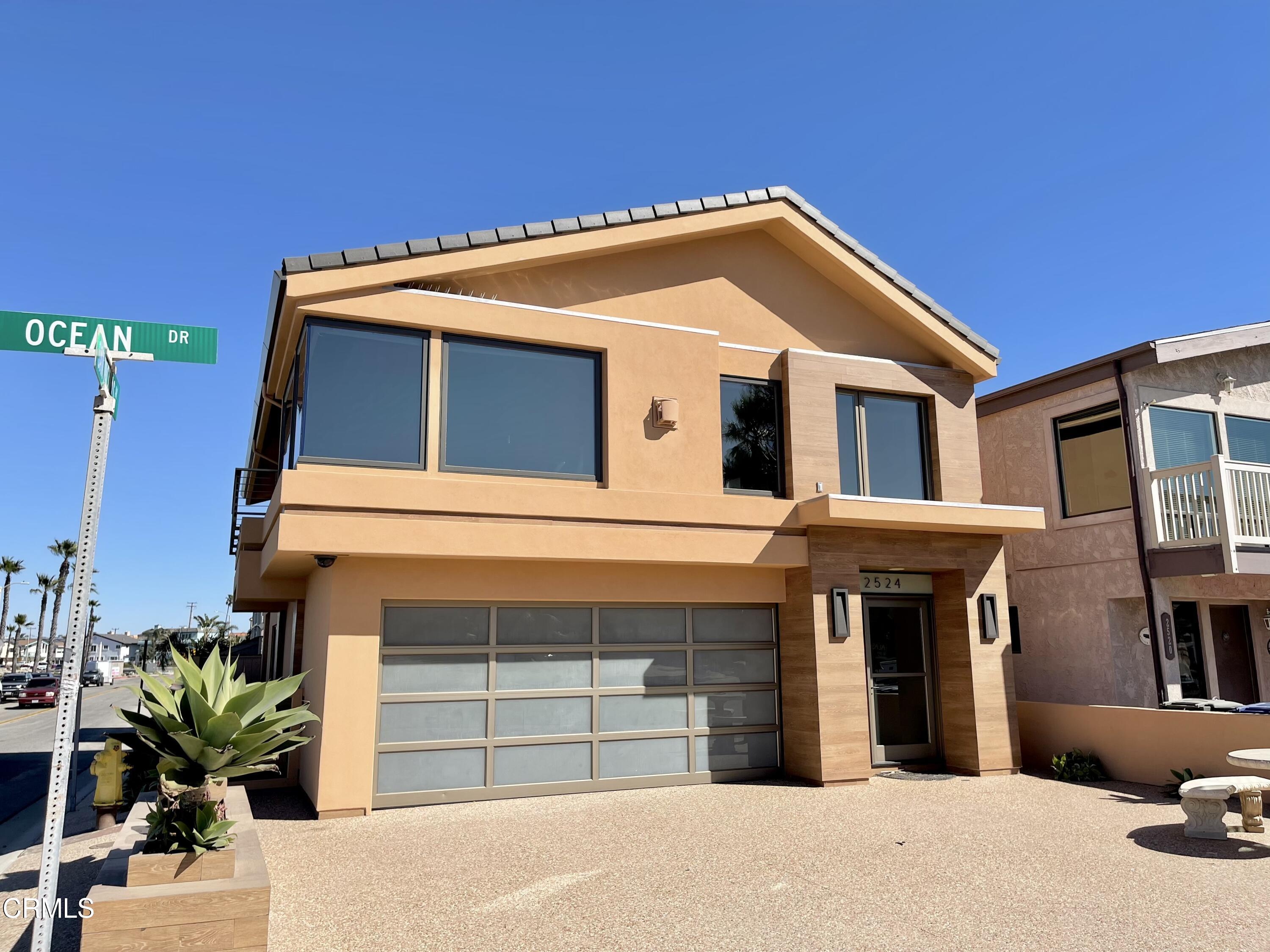 2524 Ocean Drive Oxnard, CA 93035 - Photo 23 of 28 a front view of a house with a yard