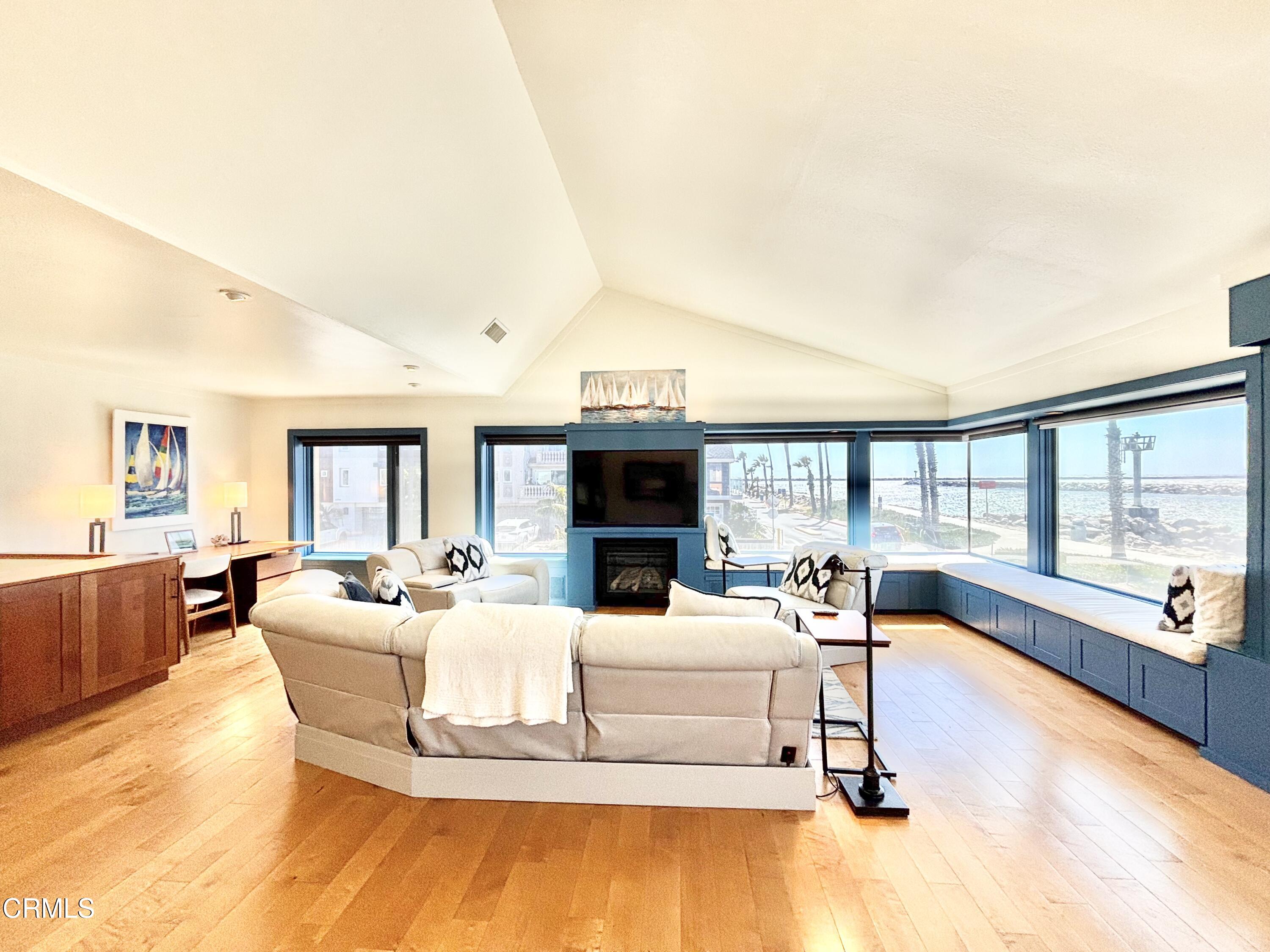 2524 Ocean Drive Oxnard, CA 93035 - Photo 3 of 28 a living room with furniture large window and a fireplace
