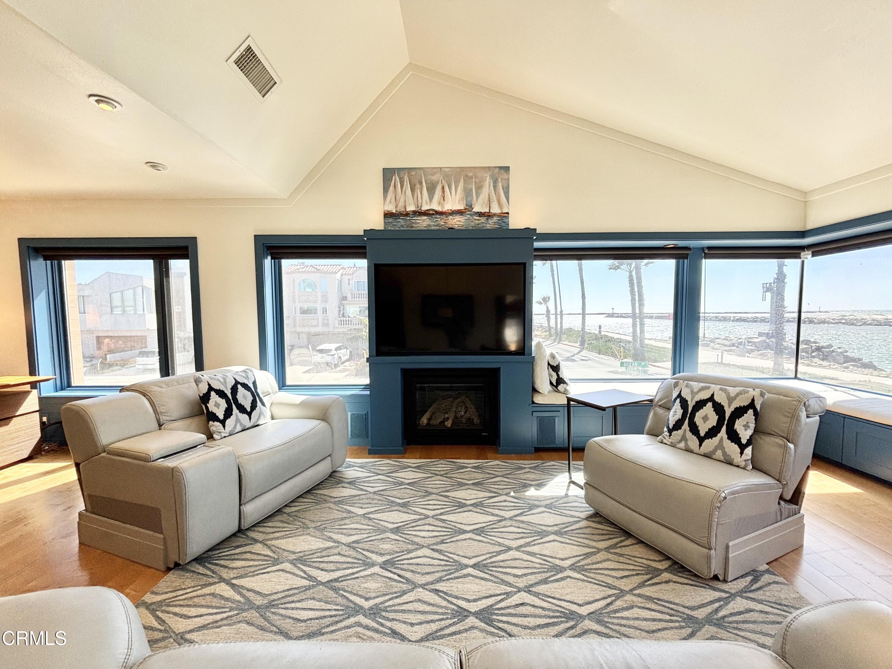2524 Ocean Drive Oxnard, CA 93035 - Photo 8 of 28 a living room with furniture a fireplace and a large window