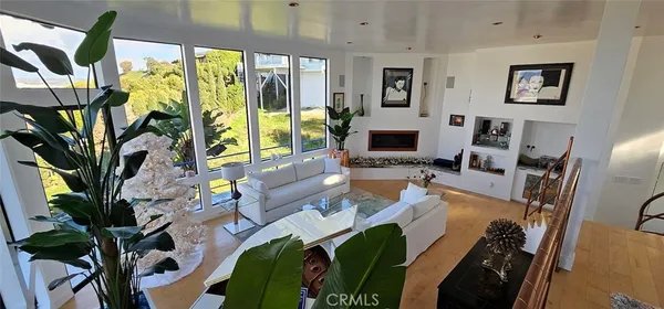 a living room with lots of furniture and a chandelier