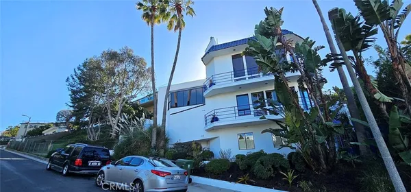 a cars parked in front of a house