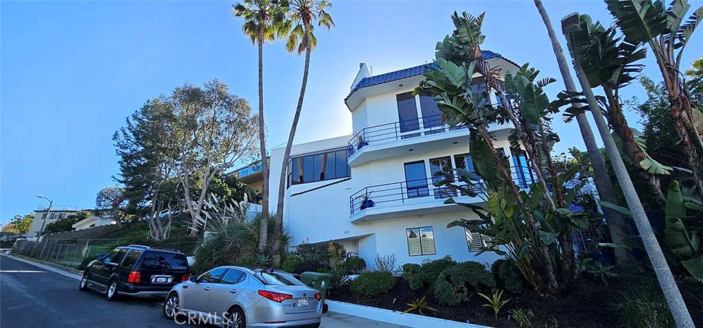 8109 Sinaloa Road Playa del Rey, CA 90293 - Photo 2 of 19 a cars parked in front of a house