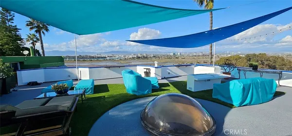 a view of a chairs and table in the patio