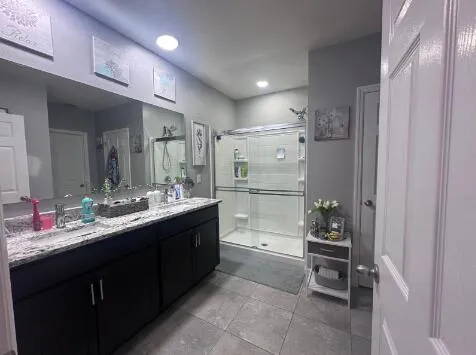 a kitchen with refrigerator and cabinets