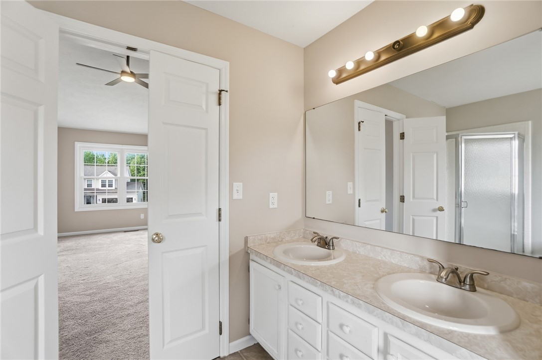 10 Chase Court Springboro, OH 45066 - Photo 37 of 75 This primary bathroom features a dual vanity, providing ample space and convenience.