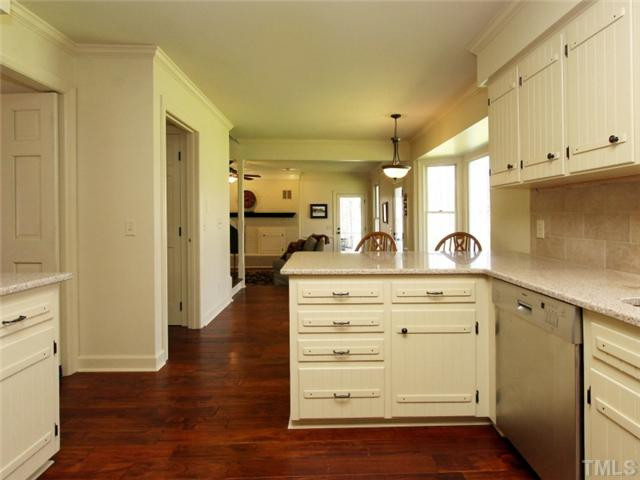 5504 Fallen Leaf Court Raleigh, NC 27606 - Photo 13 of 25 New kitchen, new appliances, granite, tile backsplash