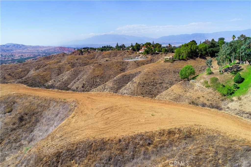 0 Edgemont Drive Redlands, CA 92373 - Photo 5 of 31 a view of a dry yard with mountains in the background