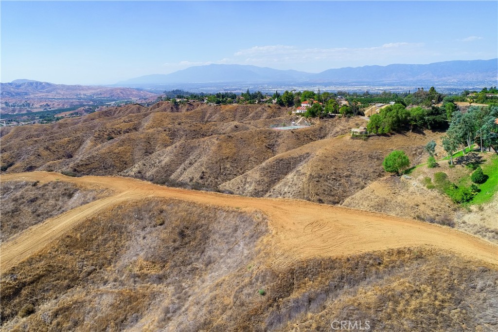0 Edgemont Drive Redlands, CA 92373 - Photo 6 of 31 a view of a dry yard with mountains in the background