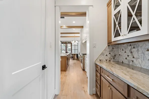 a living room with furniture a fireplace and a wooden floor