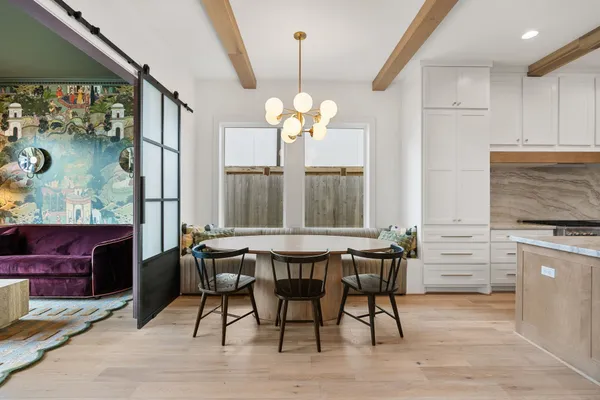 a living room with fireplace furniture and a chandelier