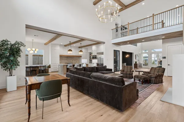 a spacious bathroom with a granite countertop sink mirror and bathtub
