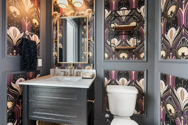 a bathroom with a sink mirror and shower