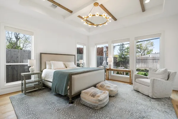 a living room with furniture or chandelier and a flat screen tv
