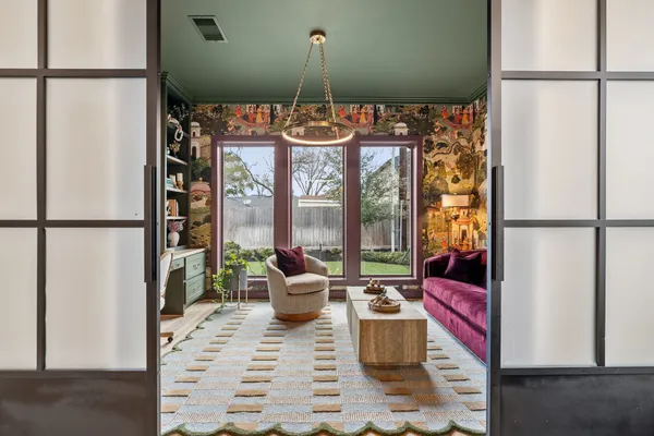 a kitchen with a counter top space a sink appliances and cabinets