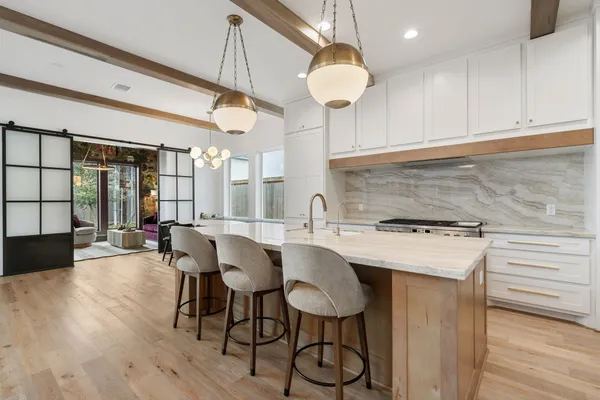 a view of a kitchen from the hallway