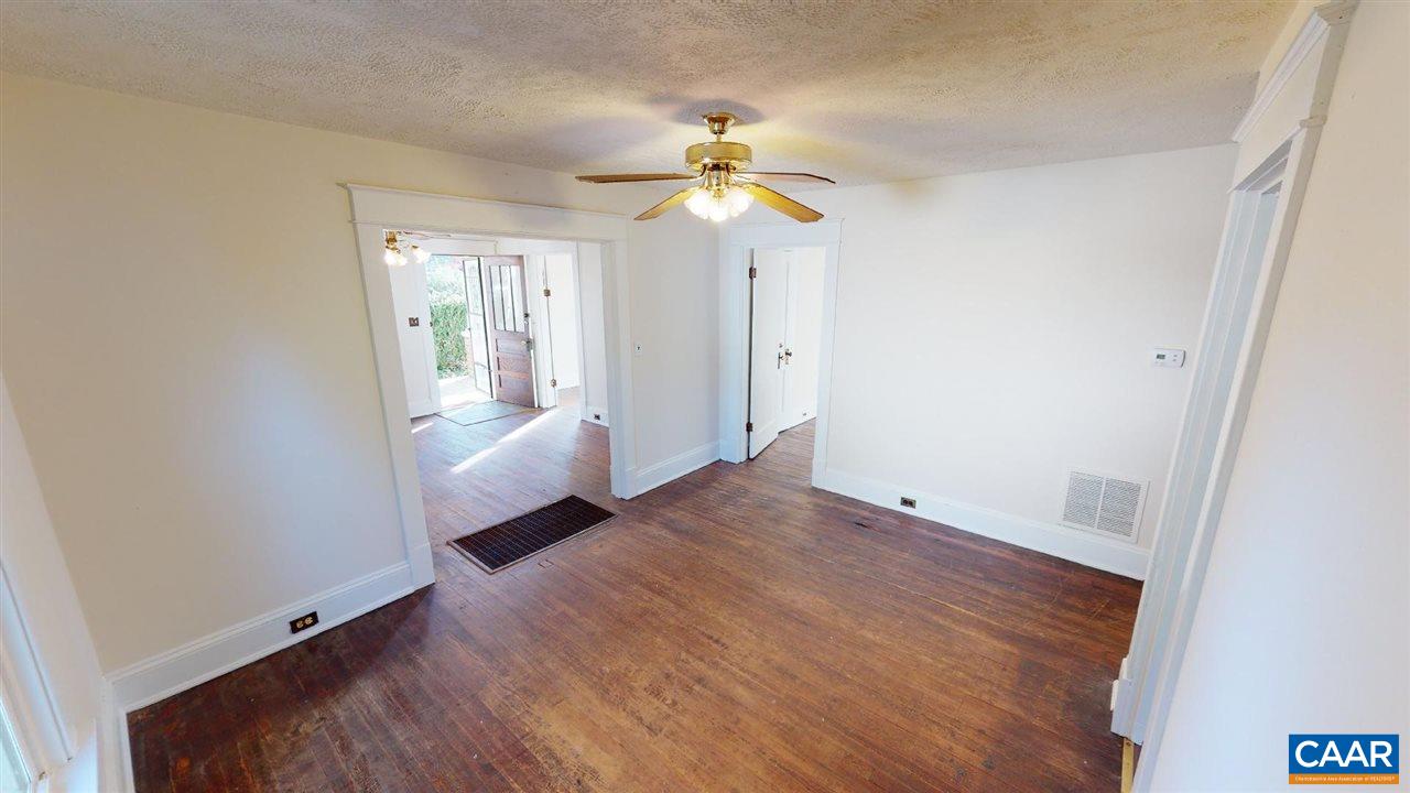 241 Shamrock Road Charlottesville, VA 22903 - Photo 15 of 24 a view of an empty room with window and wooden floor