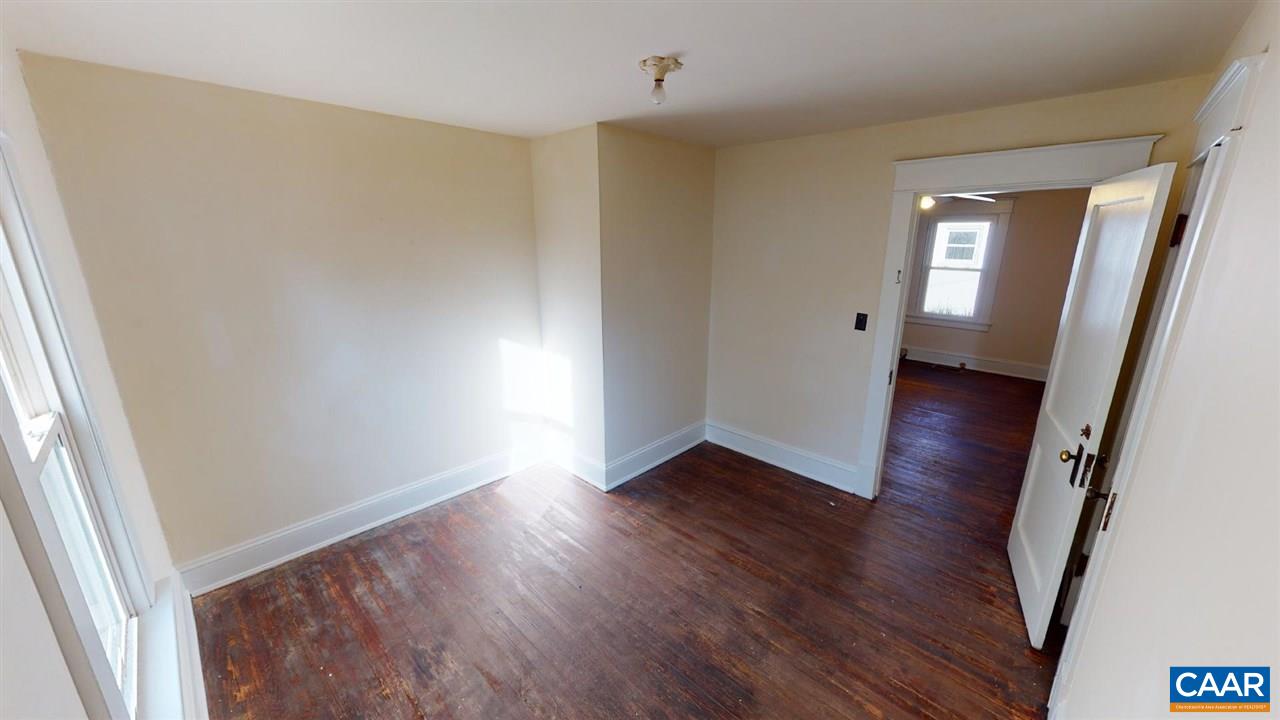 241 Shamrock Road Charlottesville, VA 22903 - Photo 18 of 24 an empty room with wooden floor and windows