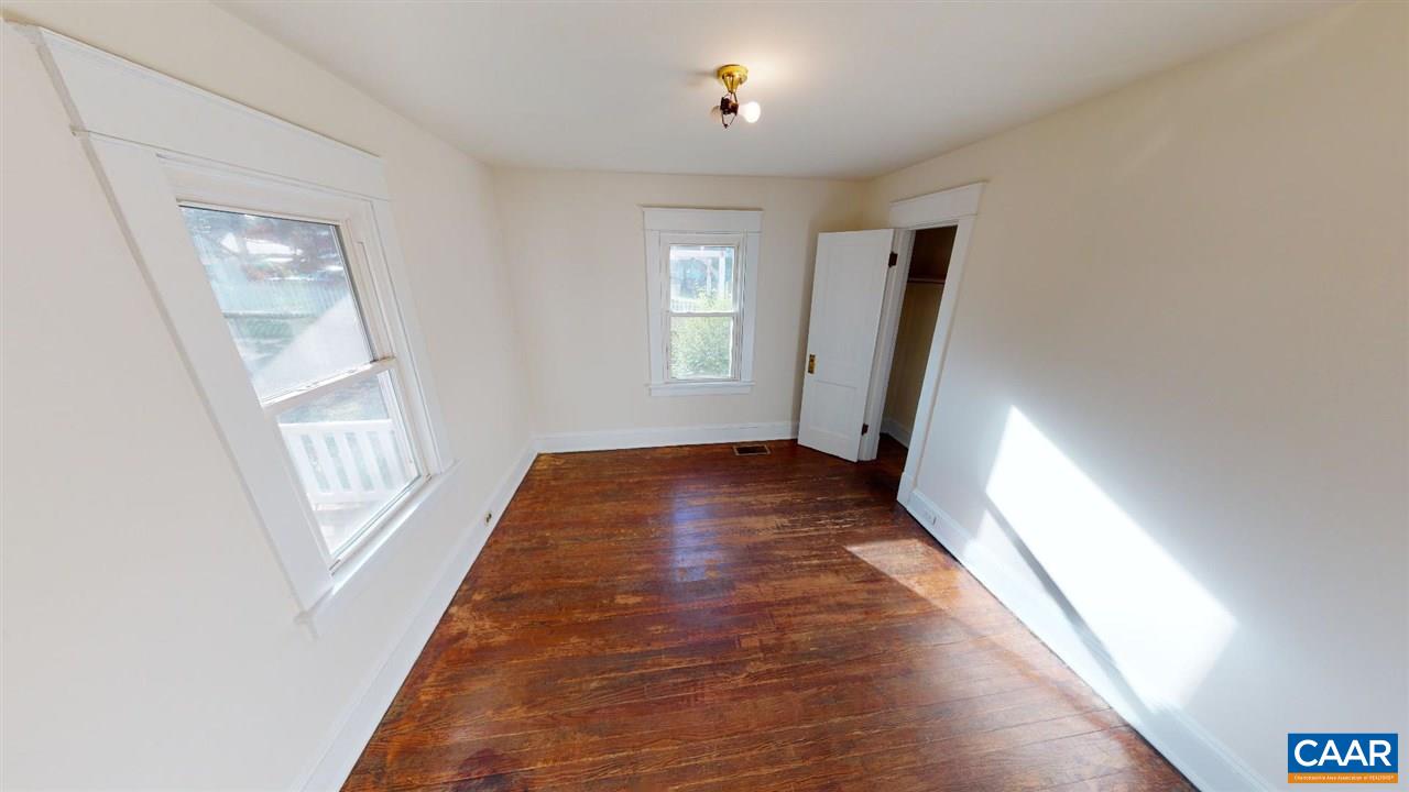 241 Shamrock Road Charlottesville, VA 22903 - Photo 19 of 24 wooden floor in an empty room with a window
