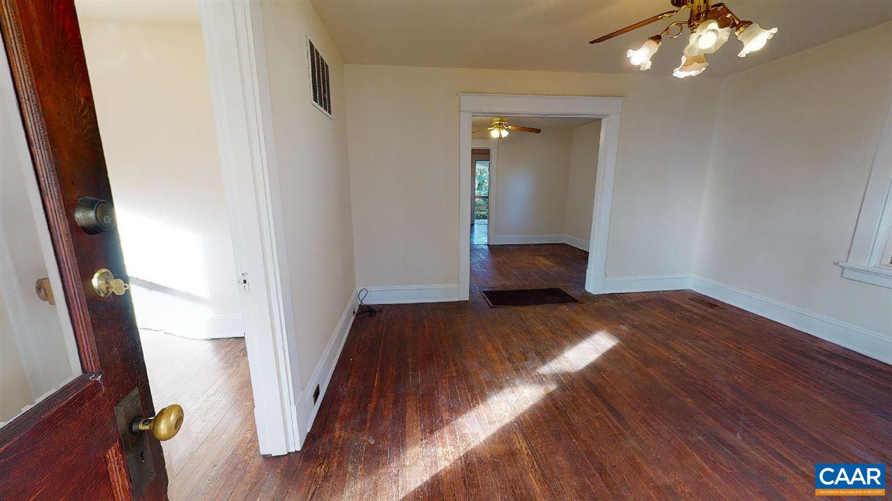 241 Shamrock Road Charlottesville, VA 22903 - Photo 7 of 24 a bedroom with a bed and a mirror