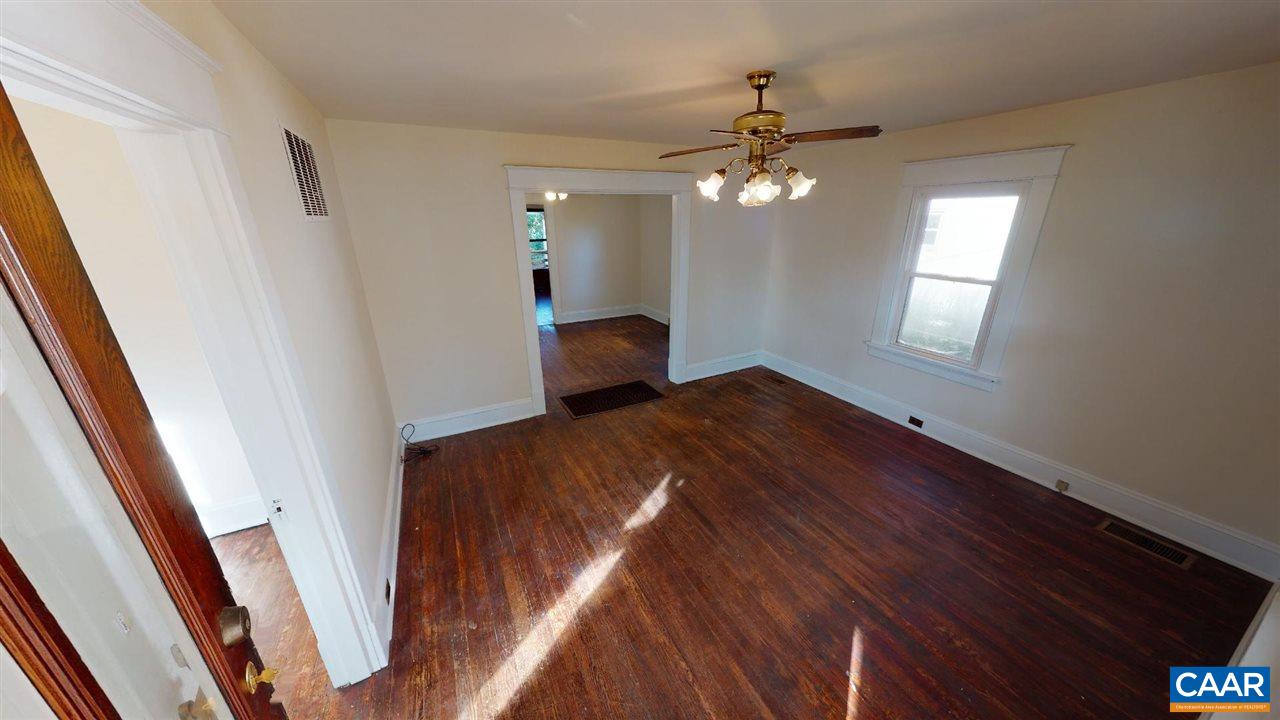 241 Shamrock Road Charlottesville, VA 22903 - Photo 9 of 24 a view of an empty room with wooden floor and a window