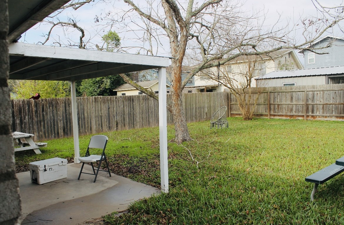 202 Byron Drive Victoria, TX 77901 - Photo 6 of 7 a view of backyard with seating area and green space