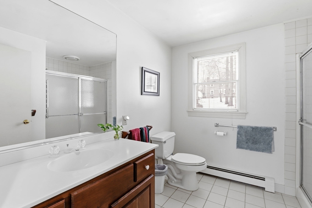 49 Jackson Road Scituate, MA 02066 - Photo 17 of 25 a bathroom with a sink toilet and a mirror