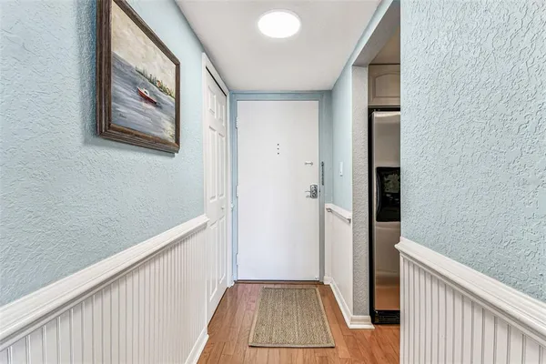 a kitchen with sink stove and cabinets