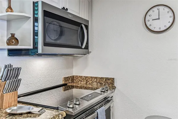 a kitchen with a sink stove and refrigerator