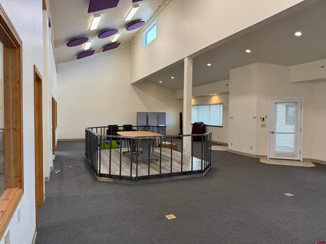 a view of game room with windows