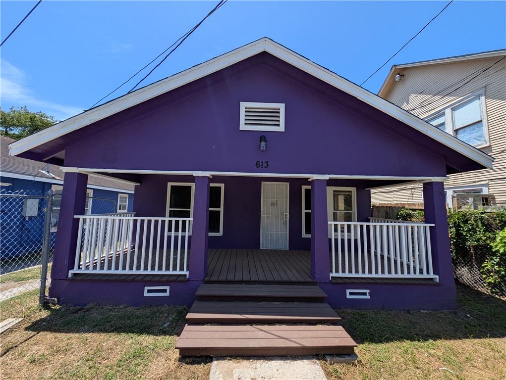 613 6th Street Corpus Christi, TX 78401 - Photo 1 of 9 a view of a house with wooden deck and furniture