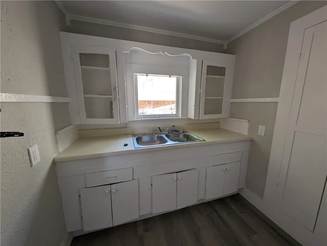 a bathroom with a sink and a window