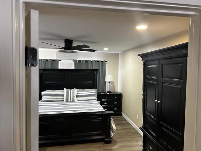 a view of kitchen and refrigerator