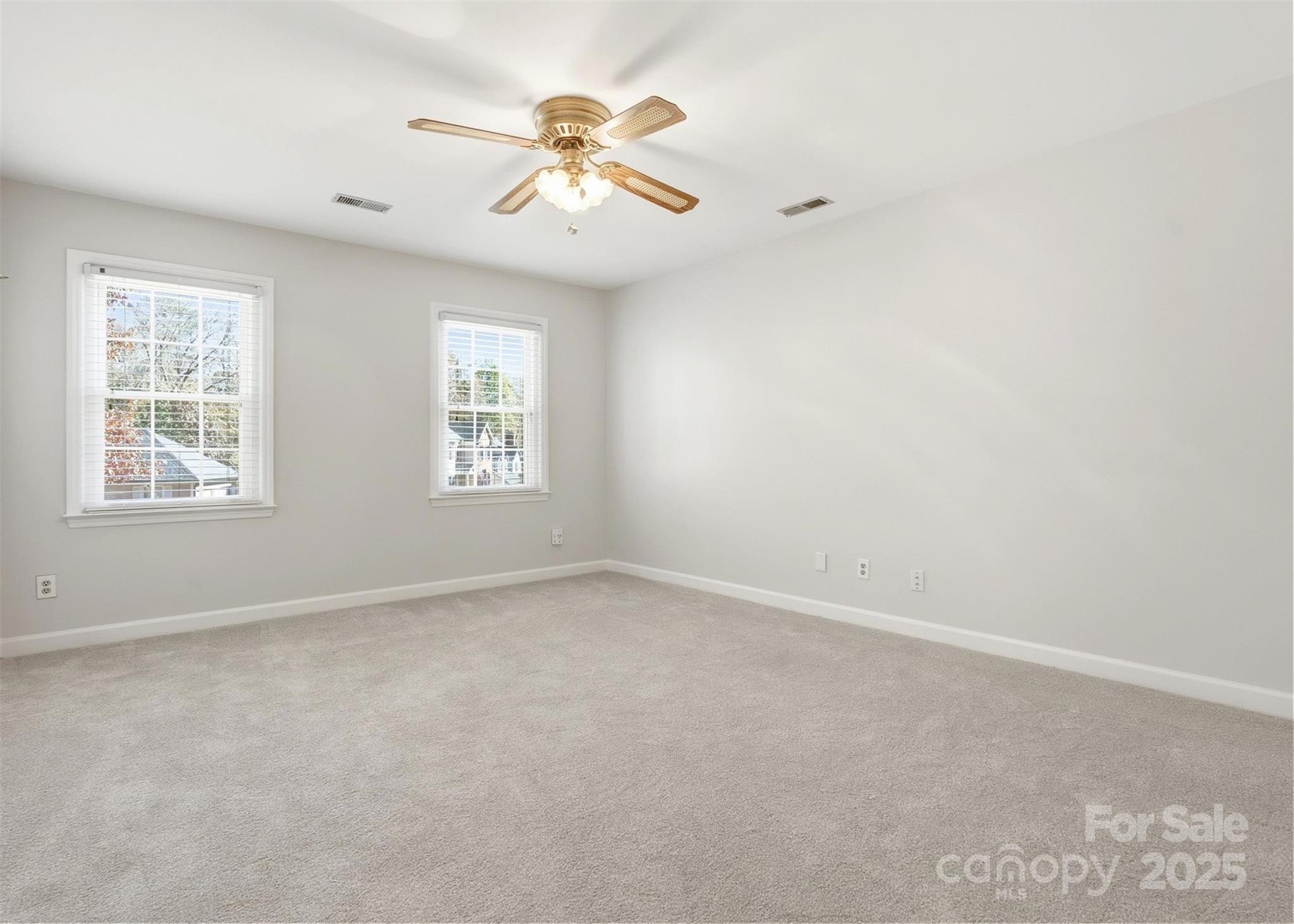 2621 Brightmoor Ridge Drive Matthews, NC 28105 - Photo 13 of 24 an empty room with windows and fan
