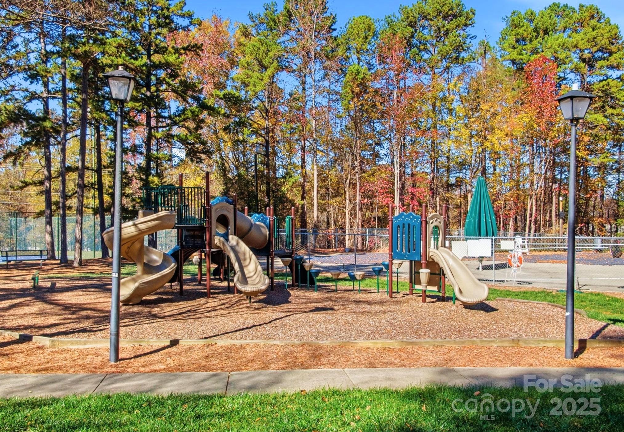 2621 Brightmoor Ridge Drive Matthews, NC 28105 - Photo 23 of 24 a view of a park with swings