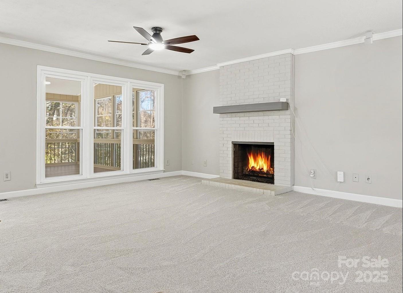 2621 Brightmoor Ridge Drive Matthews, NC 28105 - Photo 6 of 24 a view of an empty room with a fireplace and a window