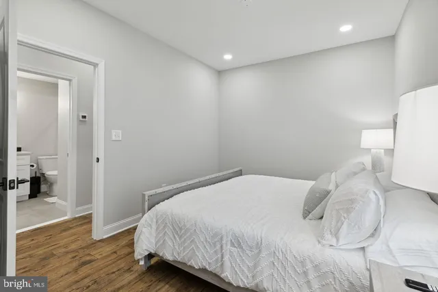 a bedroom with a bed and a view of bathroom