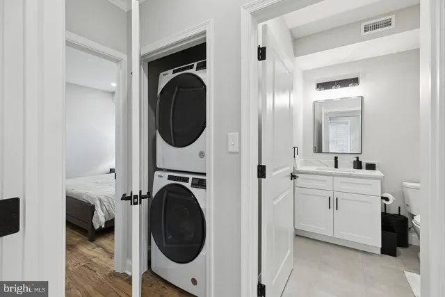 a view of a hallway with washer and dryer
