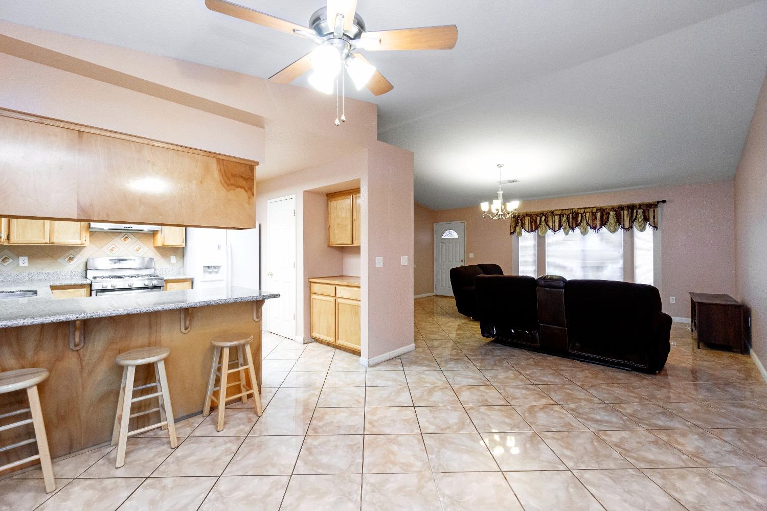 1920 Truman Drive Madera, CA 93638 - Photo 8 of 18 a living room with a couch and a view of kitchen