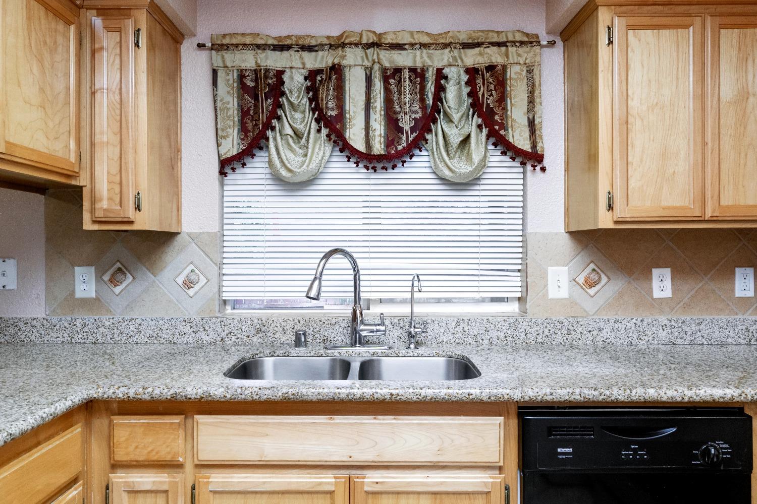 1920 Truman Drive Madera, CA 93638 - Photo 10 of 18 a kitchen with a sink and cabinets