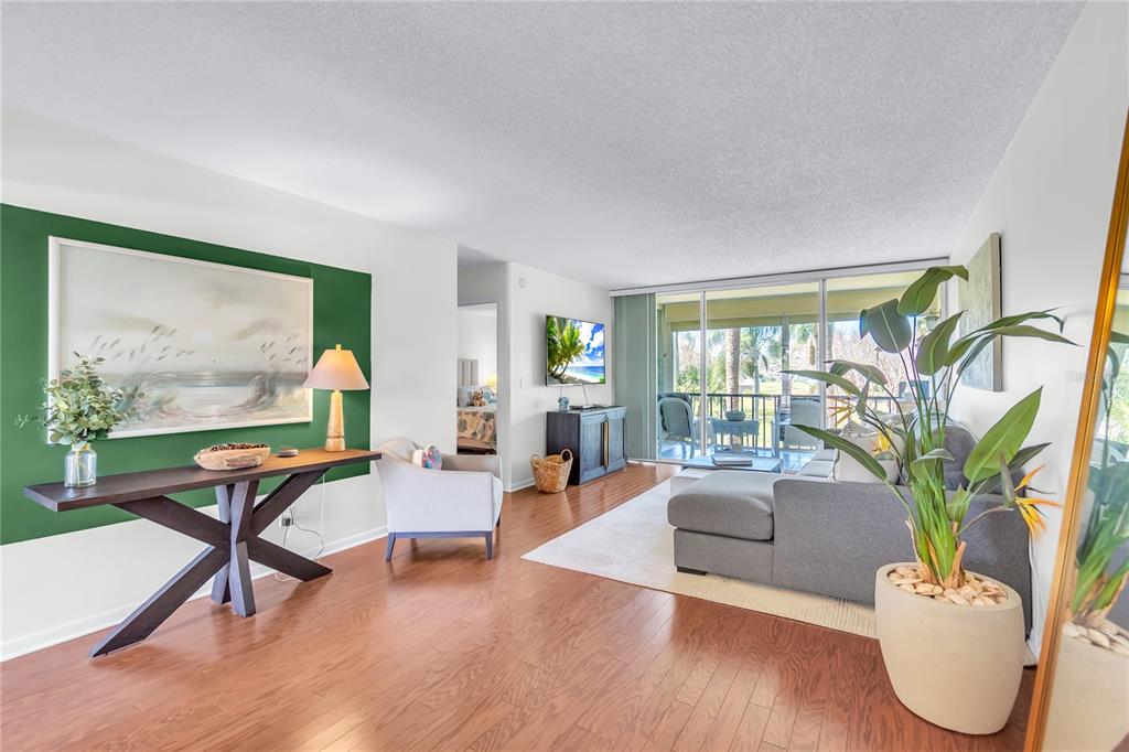 12200 Vonn Road, Unit 2206 Largo, FL 33774 - Photo 15 of 60 a living room with furniture potted plant and a large window
