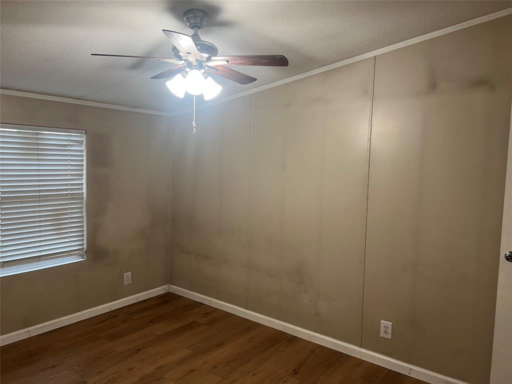 4654 County Road 1078 Princeton, TX 75407 - Photo 2 of 8 a room with a fan and a window