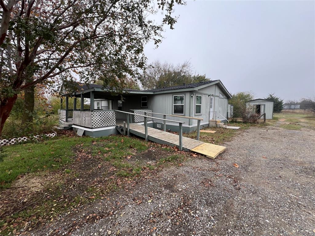 4654 County Road 1078 Princeton, TX 75407 - Photo 8 of 8 a view of a house with a yard and sitting area