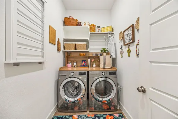 a utility room with dryer and washer